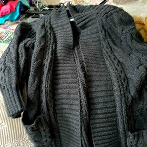 Long women’s cardigan sweater coat with front pockets, gray cable design